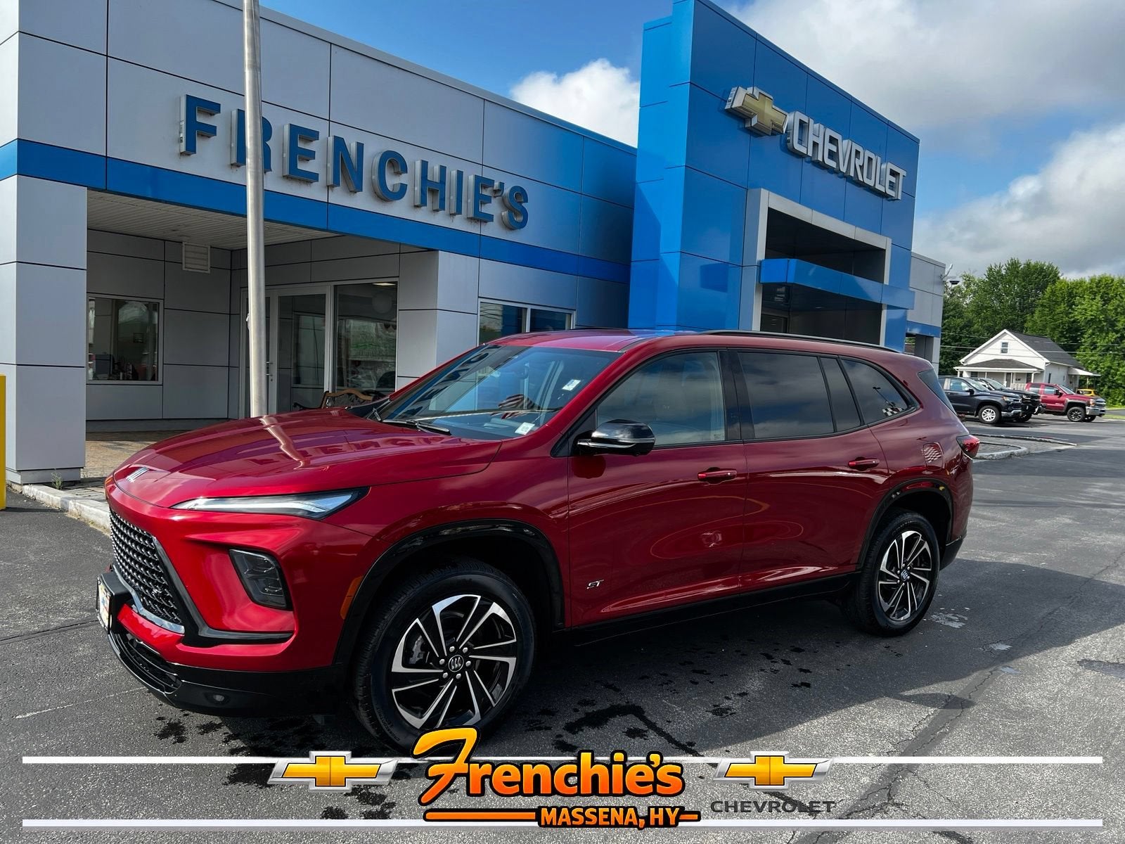 2025 Buick Enclave Sport Touring in Cherry Red Tintcoat — front three-quarter view